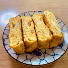 รูปของ お弁当の定番卵焼き〜♪