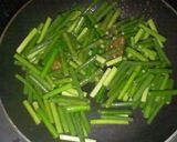 メキシコ風；豚肉とニンニクの芽の炒め物。作り方3写真